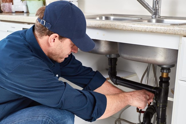 Plumbing technician at work